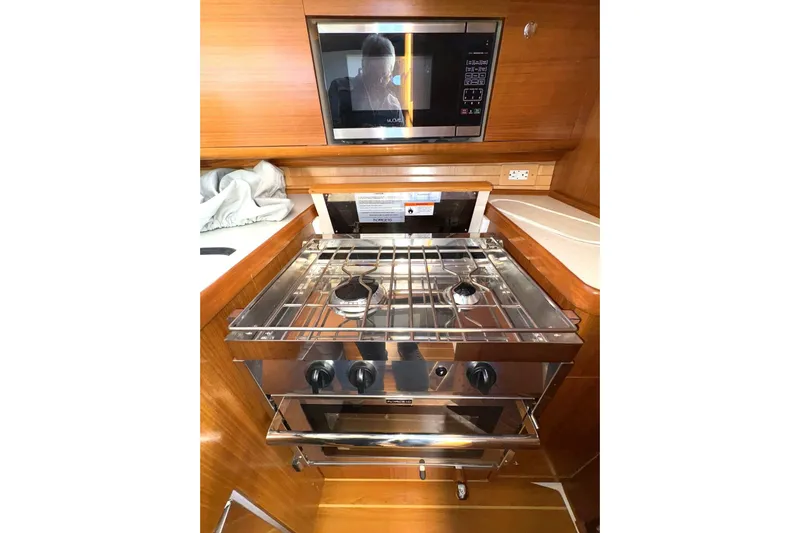 Sea Fever IV Yacht Photos Pics Modern kitchen in 2022 Catalina 355 yacht with stove and microwave.