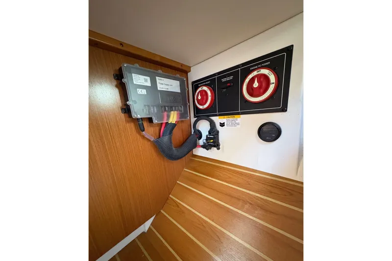 Sea Fever IV Yacht Photos Pics Electrical panel in 2022 Catalina 355 sailboat, featuring power controls and wiring.