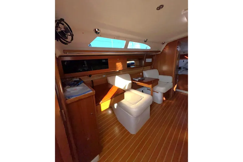 Sea Fever IV Yacht Photos Pics Interior of 2022 Catalina 355 yacht with wooden flooring and comfortable seating.