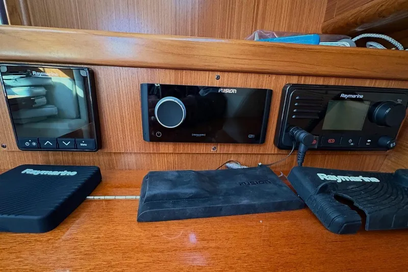 Sea Fever IV Yacht Photos Pics Control panel of a 2022 Catalina 355 sailboat with Raymarine and Fusion equipment.