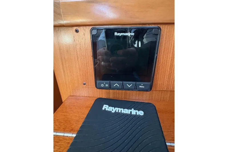 Sea Fever IV Yacht Photos Pics Raymarine display on 2022 Catalina 355 yacht, featuring wooden paneling.