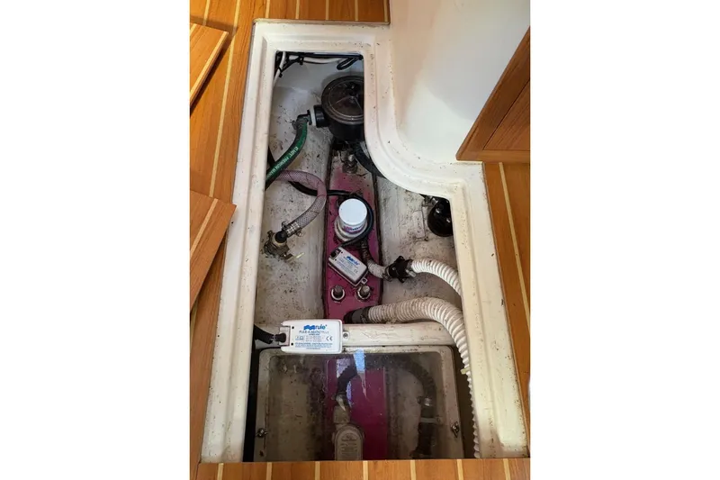 Sea Fever IV Yacht Photos Pics Bilge area of 2022 Catalina 355 sailboat with visible pump and hoses.