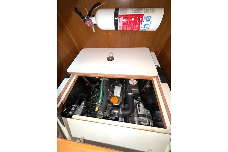 Sea Fever IV Yacht Photos Pics Engine compartment of 2022 Catalina 355 sailboat with fire extinguisher mounted above.
