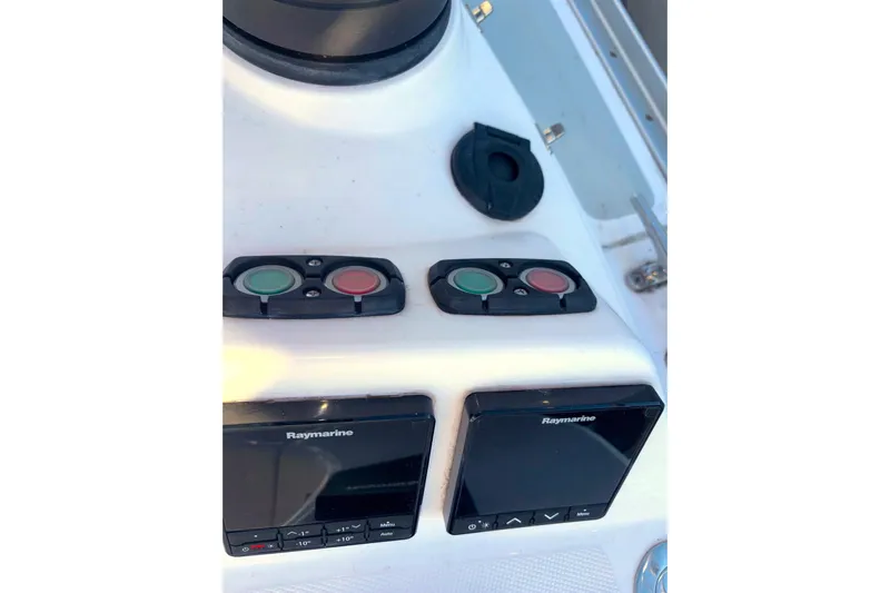 Sea Fever IV Yacht Photos Pics Control panel of a 2022 Catalina 355 sailboat with Raymarine displays.