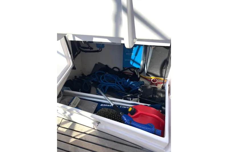 Sea Fever IV Yacht Photos Pics Storage compartment of a 2022 Catalina 355 sailboat with ropes and equipment.