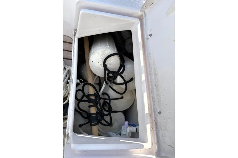 Sea Fever IV Yacht Photos Pics Storage compartment on 2022 Catalina 355 sailboat with ropes and fenders.