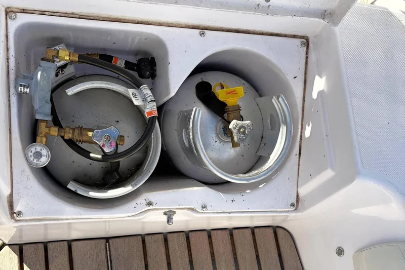 Sea Fever IV Yacht Photos Pics Propane storage compartment on a 2022 Catalina 355 sailboat, featuring two gas cylinders.