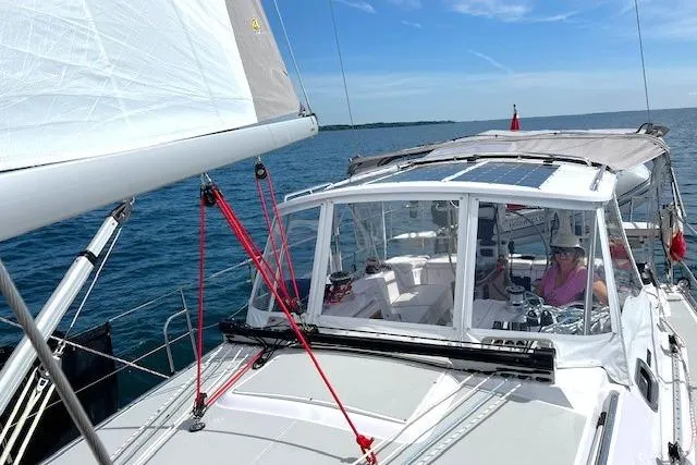 Sea Fever IV Yacht Photos Pics 2022 Catalina 355 sailboat cruising on open water under clear blue skies.