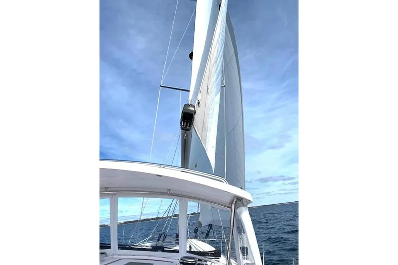 Sea Fever IV Yacht Photos Pics 2022 Catalina 355 sailboat on open water under clear blue sky.