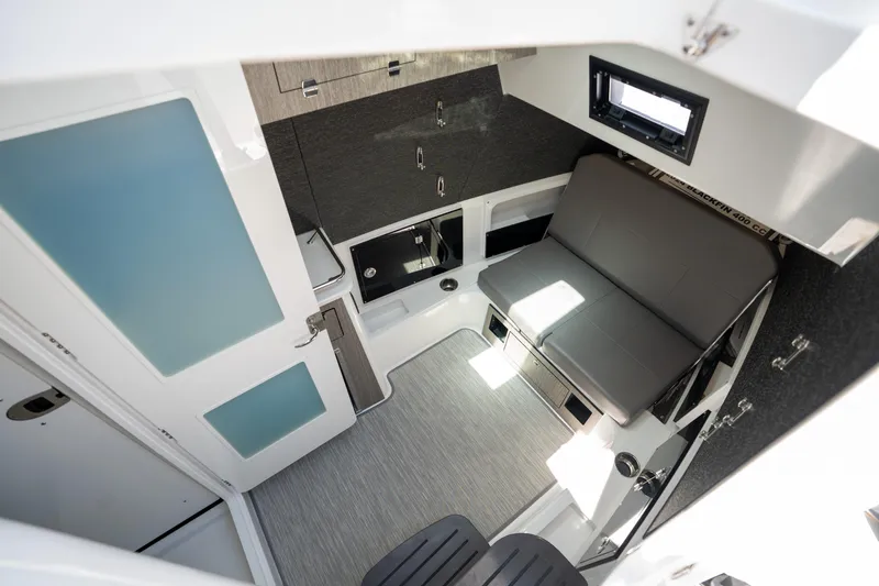  Yacht Photos Pics 2024 Blackfin 400CC cabin interior with modern seating and compact design.