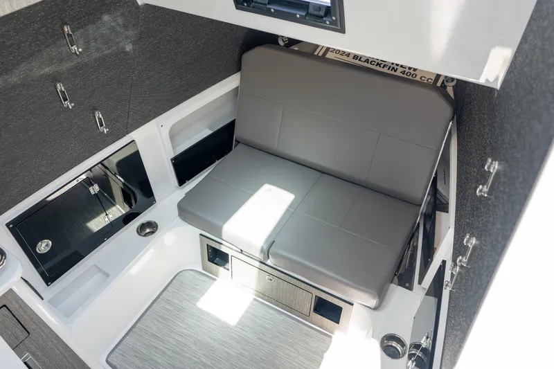  Yacht Photos Pics 2024 Blackfin 400CC cabin interior with gray seating and modern design elements.