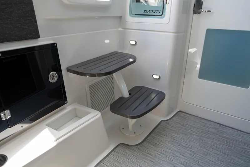  Yacht Photos Pics Interior of 2024 Blackfin 400CC boat with modern seating and storage features.