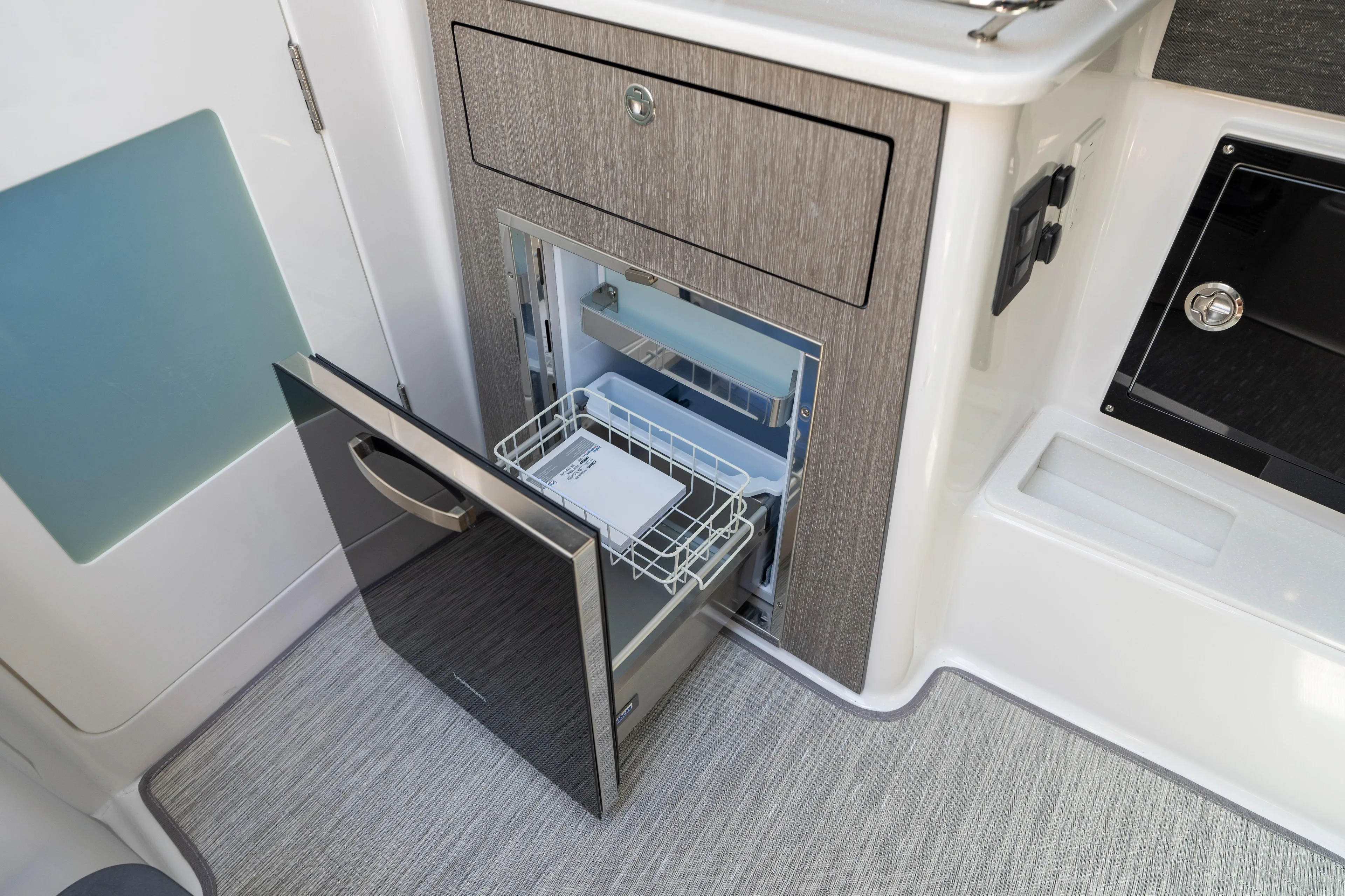  Yacht Photos Pics 2024 Blackfin 400CC boat interior with open drawer and built-in appliance.