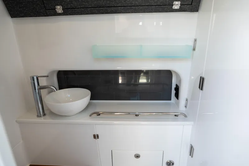  Yacht Photos Pics 2024 Blackfin 400CC interior with modern sink and sleek cabinetry.