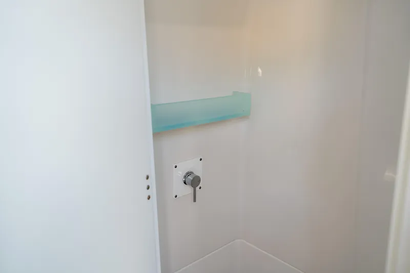  Yacht Photos Pics 2024 Blackfin 400CC boat interior shower with minimalist design and modern fixtures.