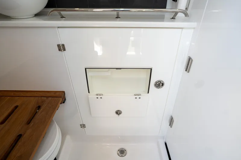  Yacht Photos Pics 2024 Blackfin 400CC bathroom with sleek white cabinetry and modern fixtures.
