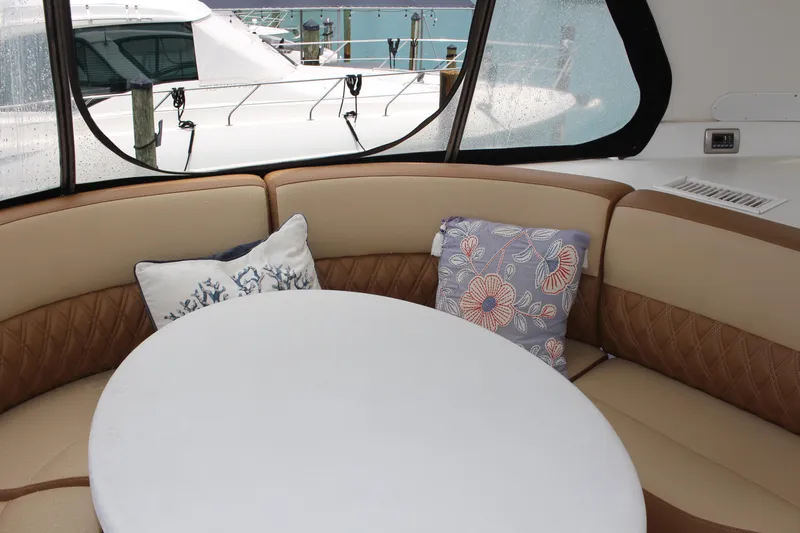 Social Distancing Yacht Photos Pics Interior seating area of a 2006 Carver 560 Voyager yacht with decorative pillows.