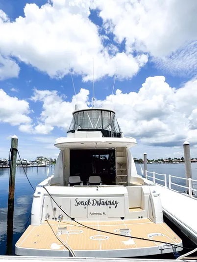 Social Distancing Yacht Photos Pics 2006 Carver 560 Voyager yacht docked under a bright blue sky.