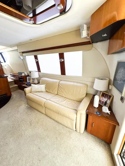 Social Distancing Yacht Photos Pics Luxurious interior of a 2006 Carver 560 Voyager yacht with beige leather sofa.