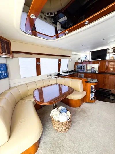 Social Distancing Yacht Photos Pics Interior of 2006 Carver 560 Voyager yacht with dining area and kitchen.