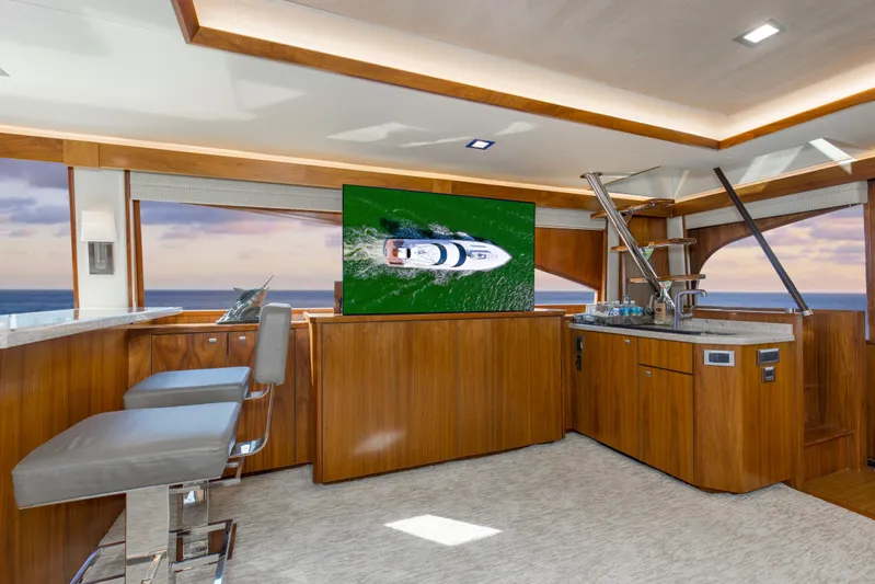 Touche Yacht Photos Pics Luxurious interior of 2016 Viking 92 Enclosed Bridge yacht with modern amenities.