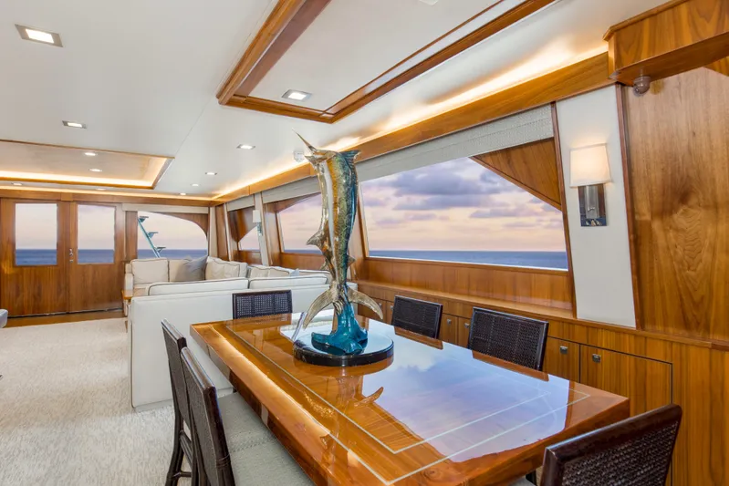 Touche Yacht Photos Pics Luxurious interior of 2016 Viking 92 Enclosed Bridge yacht with elegant dining area.