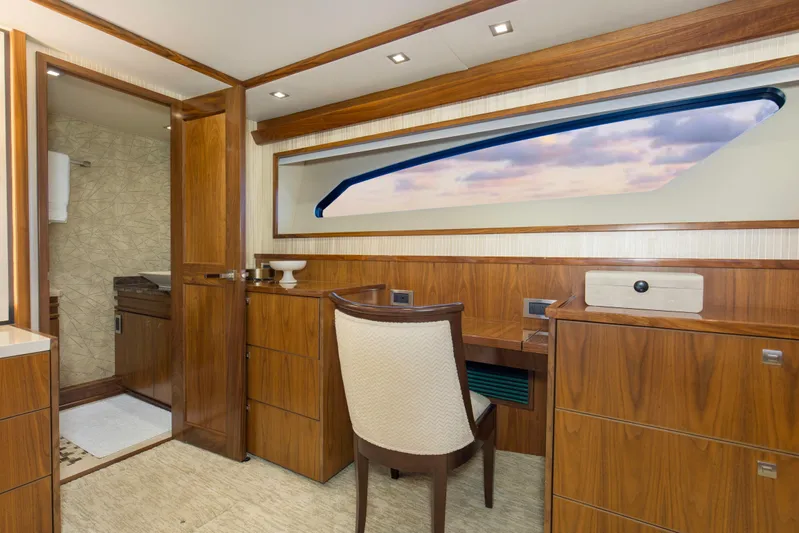 Touche Yacht Photos Pics Luxurious interior of 2016 Viking 92 Enclosed Bridge yacht with elegant wood finish and ocean view.