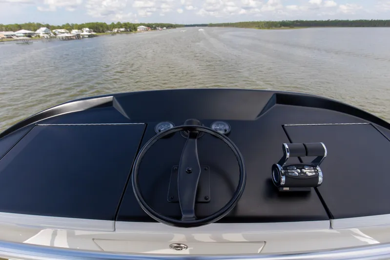 Touche Yacht Photos Pics Helm of 2016 Viking 92 Enclosed Bridge yacht on calm waters.