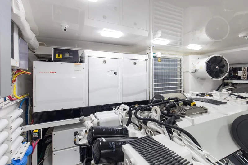 Touche Yacht Photos Pics Engine room of 2016 Viking 92 Enclosed Bridge yacht with Cummins Onan generator.