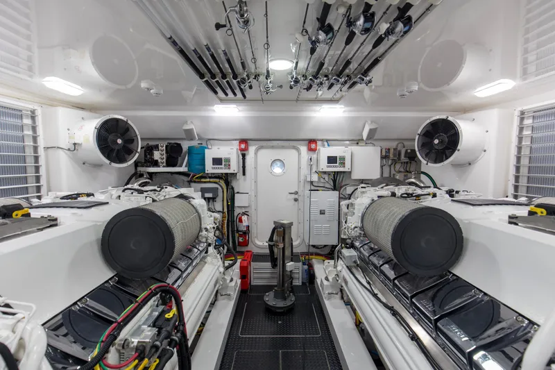 Touche Yacht Photos Pics Engine room of 2016 Viking 92 Enclosed Bridge yacht, featuring advanced equipment and fishing rods.