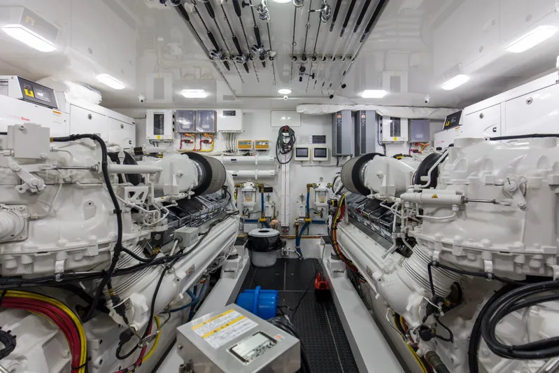 Touche Yacht Photos Pics Engine room of 2016 Viking 92 Enclosed Bridge yacht, featuring dual engines and control systems.
