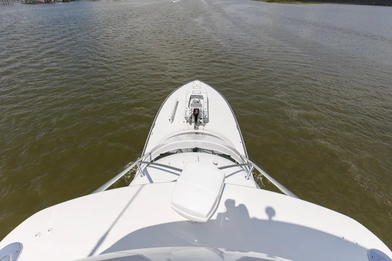 Touche Yacht Photos Pics 2016 Viking 92 Enclosed Bridge yacht cruising on calm waters.