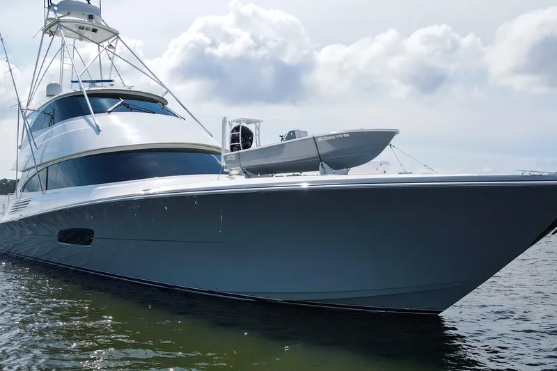 Touche Yacht Photos Pics 2016 Viking 92 Enclosed Bridge yacht on water, showcasing sleek design and luxury features.