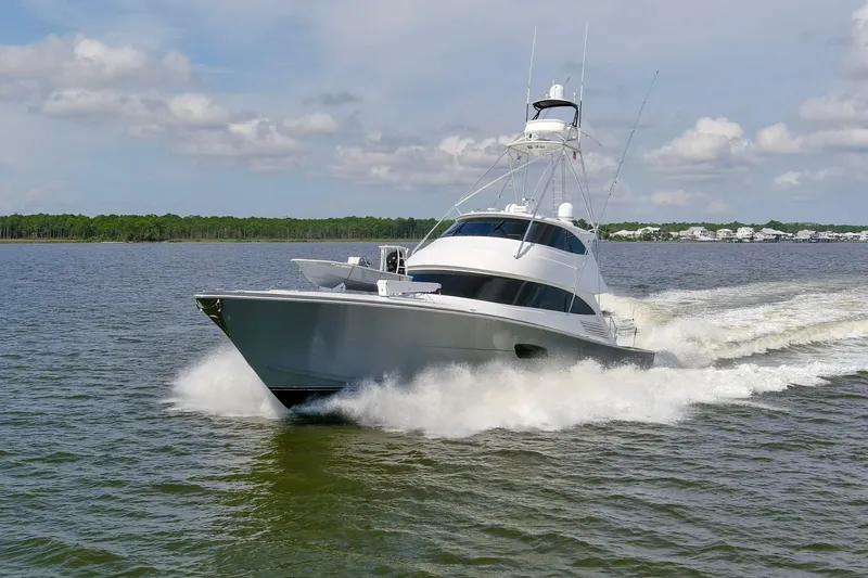 Touche Yacht Photos Pics 2016 Viking 92 Enclosed Bridge yacht cruising on open water.