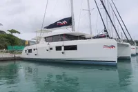 2020 Leopard 45 catamaran docked in a marina, featuring sleek design and modern sails.