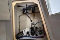 Engine compartment of a 2020 Leopard 45 yacht, showcasing mechanical components and wiring.