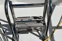 Stainless steel and wood boat ladder on a 2020 Leopard 45 yacht.