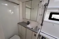 Modern bathroom in a 2020 Leopard 45 yacht, featuring sleek cabinetry and fixtures.