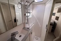 Modern bathroom in a 2020 Leopard 45 yacht, featuring sleek fixtures and a compact design.
