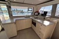 Modern kitchen interior on a 2020 Leopard 45 yacht with marina view.
