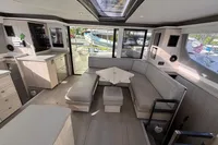 Luxurious interior of a 2020 Leopard 45 catamaran with modern seating and ample natural light.