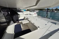 Spacious deck of 2020 Leopard 45 catamaran docked at marina.