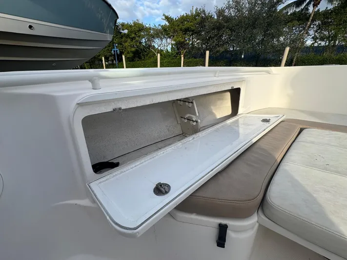  Yacht Photos Pics Open storage compartment on 2011 Everglades 320 Center Console boat.