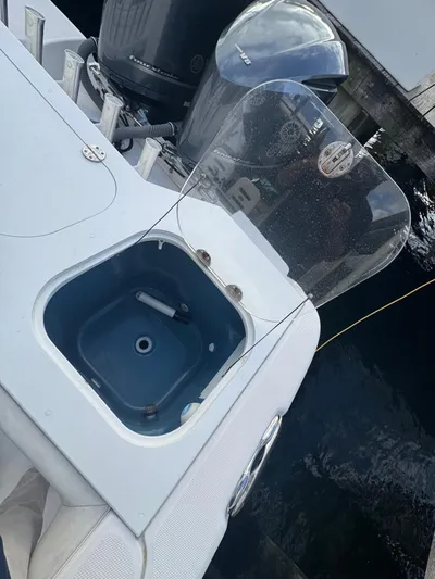  Yacht Photos Pics 2011 Everglades 320 Center Console boat with open livewell and engine view.