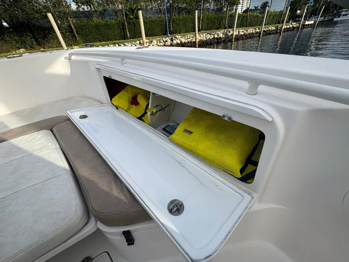  Yacht Photos Pics Storage compartment on 2011 Everglades 320 Center Console boat with life jackets inside.