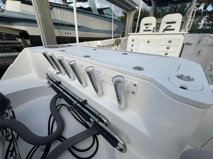  Yacht Photos Pics 2011 Everglades 320 Center Console boat interior with rod holders and storage compartments.