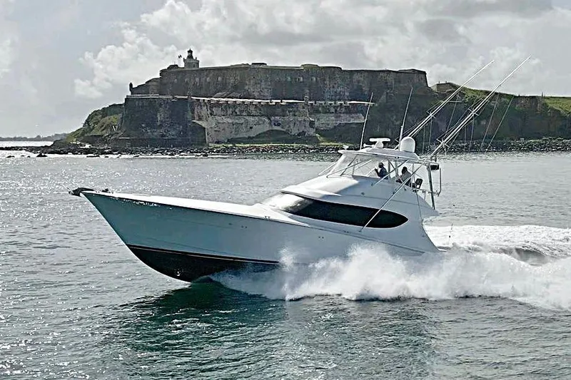  Yacht Photos Pics 2013 Hatteras GT60 yacht cruising near historic coastal fortress.