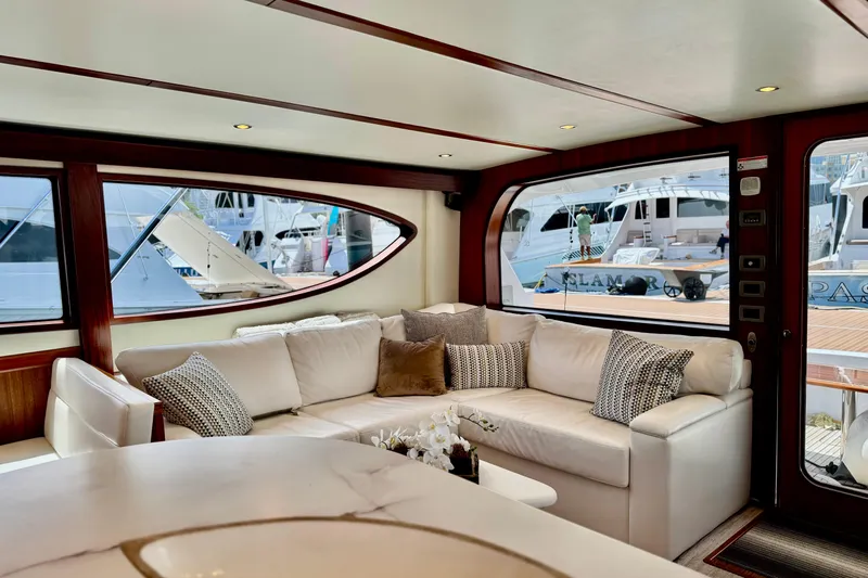  Yacht Photos Pics Luxurious interior of 2013 Hatteras GT60 yacht with plush seating and large windows.