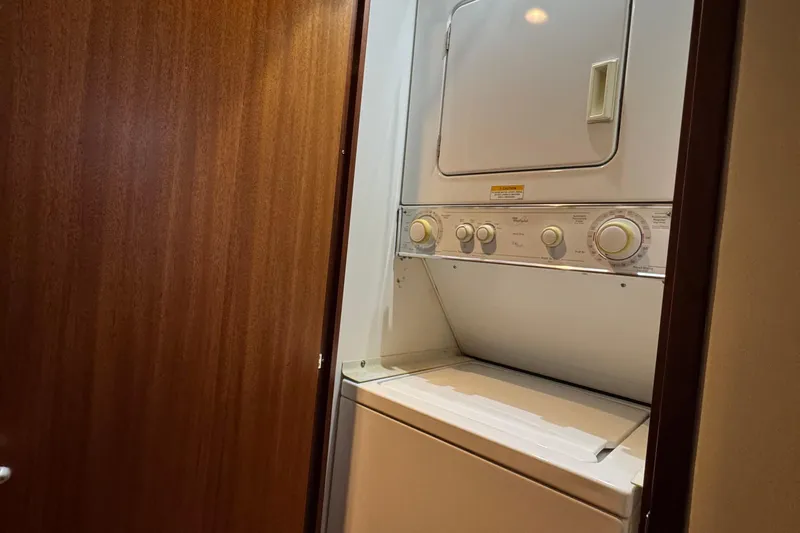  Yacht Photos Pics Stacked washer and dryer in 2013 Hatteras GT60 yacht interior.