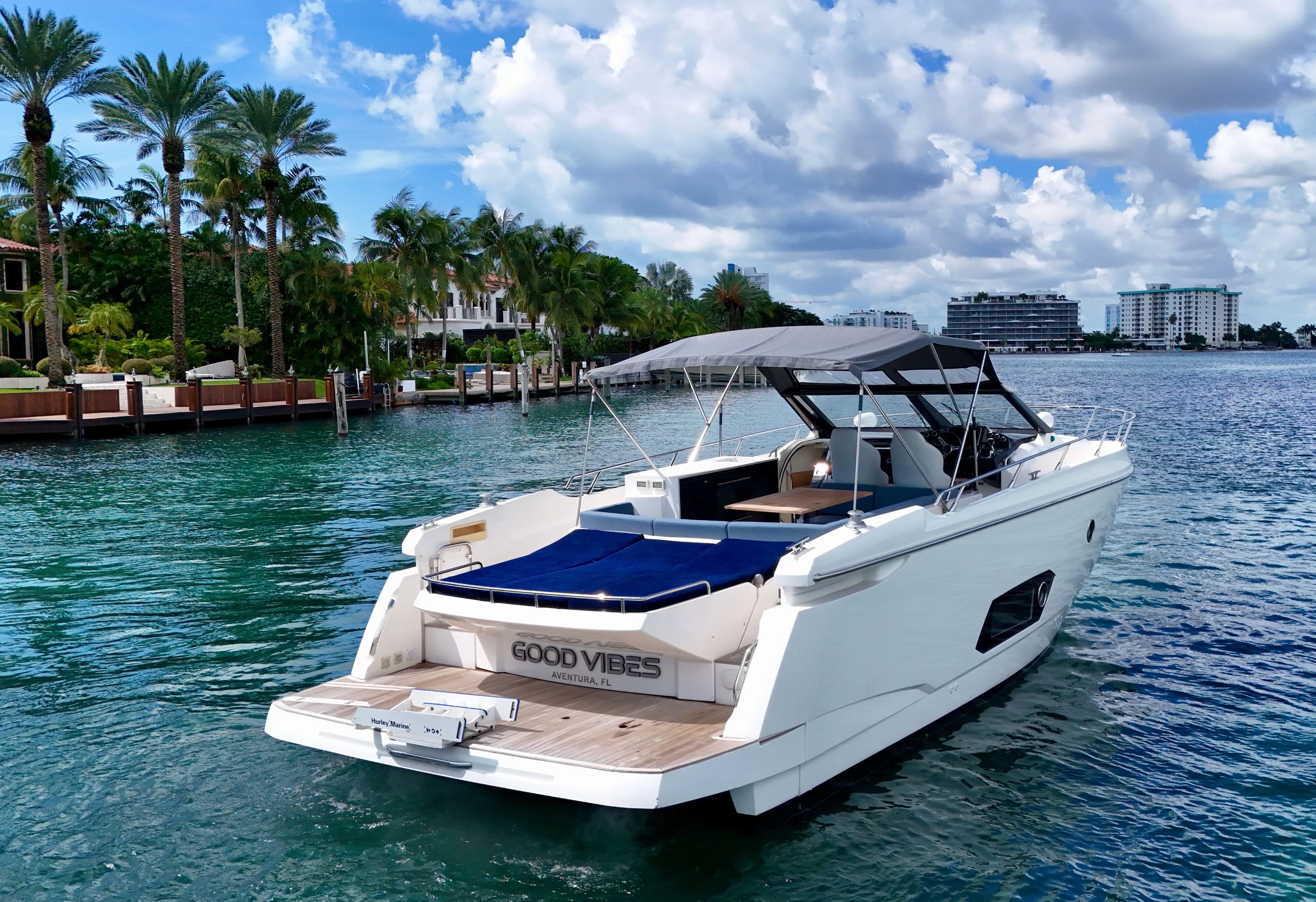  Yacht Photos Pics Luxury Absolute 40 yacht on clear water, surrounded by palm trees and buildings, 2014 model.
